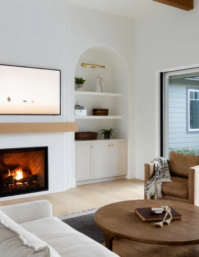 A living room with a fireplace and tv.