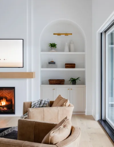 A living room with a fireplace and tv.