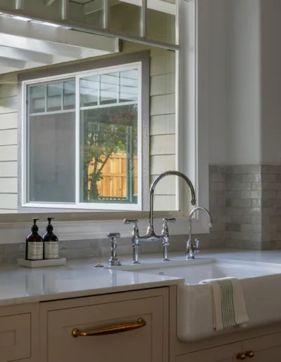 A kitchen with a sink and a window.