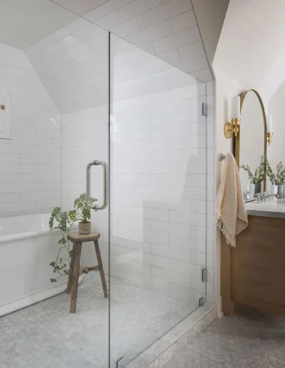 A white bathroom with a glass shower and tub.
