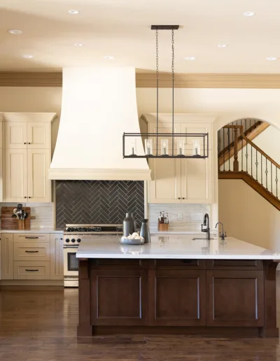 A large kitchen with a center island and hardwood floors.